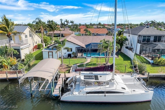 1528 SW 52nd Ln, Cape Coral, FL 33914 - dock area with boat lift, a water view, a residential view, and a lanai