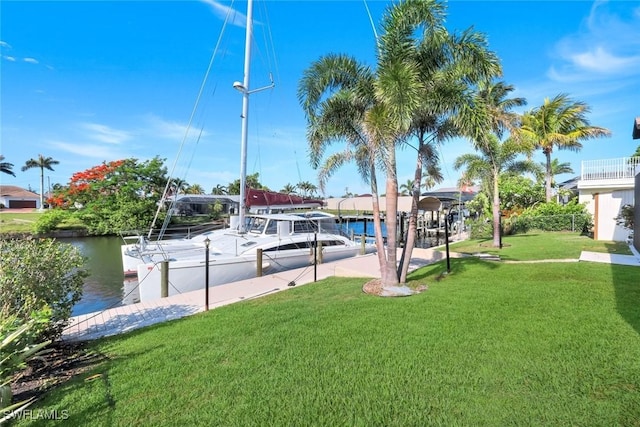 1528 SW 52nd Ln, Cape Coral, FL 33914 - view of green lawn with a dock and a water view