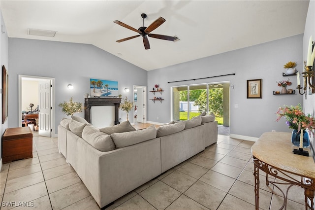1226 SW 15th Ter, Cape Coral, FL 33991 - living room featuring lofted ceiling, light tile patterned floors, and a ceiling fan