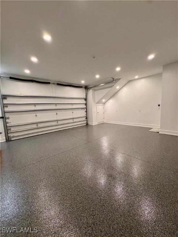 777 Broad Ct S, Naples, FL 34102 - garage with baseboards and recessed lighting