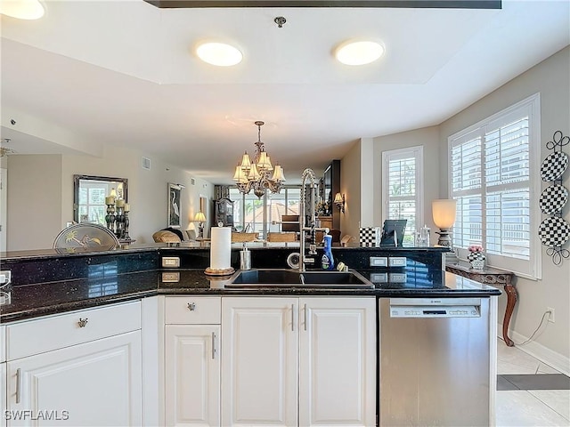 1131 Swallow Ave Unit 3-202, Marco Island, FL 34145 - kitchen featuring stainless steel dishwasher, a chandelier, light tile patterned flooring, decorative light fixtures, and white cabinets
