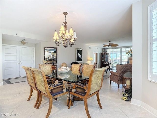 1131 Swallow Ave Unit 3-202, Marco Island, FL 34145 - dining space featuring a chandelier, light tile patterned flooring, and a ceiling fan