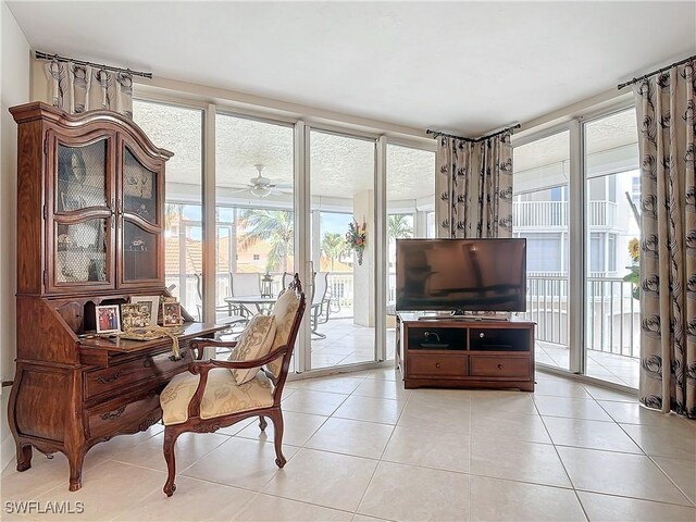 1131 Swallow Ave Unit 3-202, Marco Island, FL 34145 - living area with a ceiling fan and light tile patterned floors