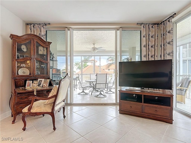 1131 Swallow Ave Unit 3-202, Marco Island, FL 34145 - sitting room with a ceiling fan and light tile patterned floors