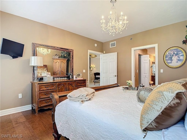 1131 Swallow Ave Unit 3-202, Marco Island, FL 34145 - bedroom with a chandelier and dark wood-style flooring