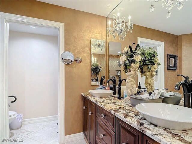 1131 Swallow Ave Unit 3-202, Marco Island, FL 34145 - full bathroom featuring double vanity and a chandelier
