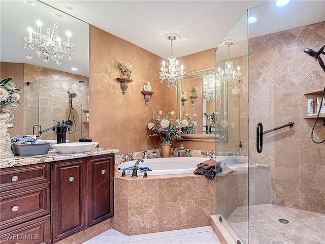 1131 Swallow Ave Unit 3-202, Marco Island, FL 34145 - full bathroom with a stall shower, a garden tub, vanity, tile patterned floors, and a chandelier