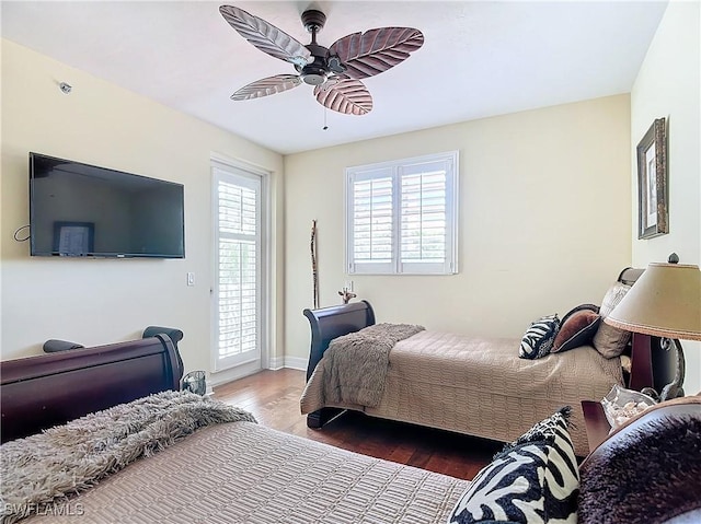 1131 Swallow Ave Unit 3-202, Marco Island, FL 34145 - bedroom with wood finished floors, access to exterior, and ceiling fan