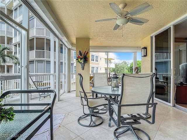 1131 Swallow Ave Unit 3-202, Marco Island, FL 34145 - sunroom featuring ceiling fan and outdoor dining area