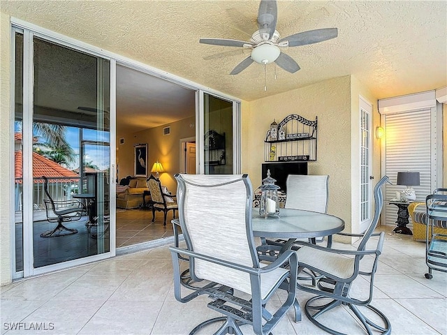 1131 Swallow Ave Unit 3-202, Marco Island, FL 34145 - view of patio featuring outdoor dining space and a ceiling fan