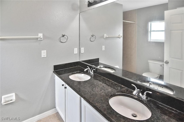 4016 35th St SW, Lehigh Acres, FL 33976 - bathroom with toilet, double vanity, and a shower