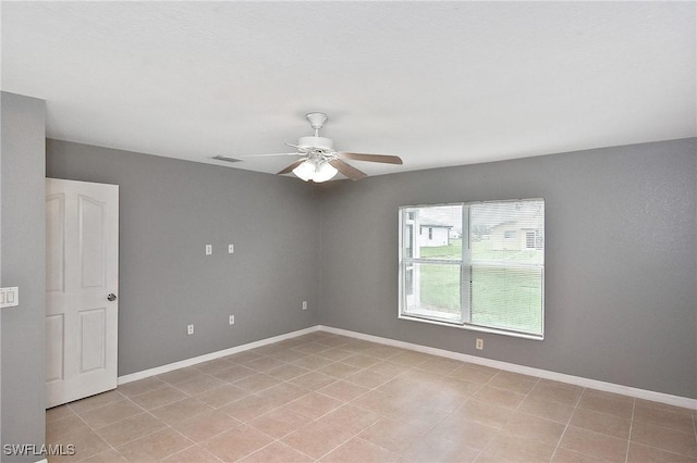 4016 35th St SW, Lehigh Acres, FL 33976 - spare room featuring ceiling fan and baseboards