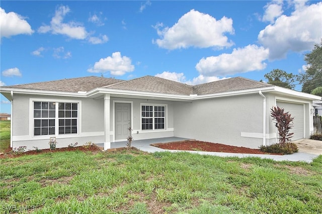 4016 35th St SW, Lehigh Acres, FL 33976 - view of front of property with a garage, stucco siding, and a front yard