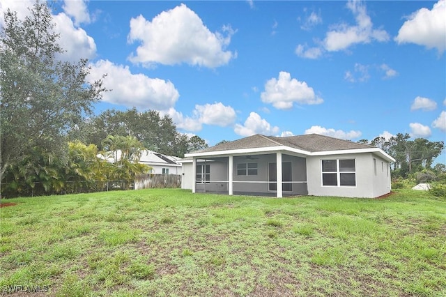 4016 35th St SW, Lehigh Acres, FL 33976 - back of house with a sunroom, stucco siding, and ceiling fan
