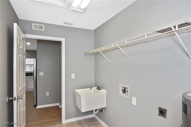 4016 35th St SW, Lehigh Acres, FL 33976 - washroom featuring hookup for a washing machine, baseboards, and electric dryer hookup