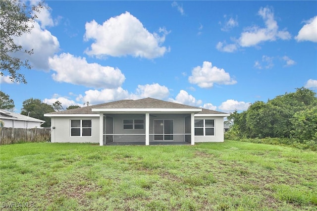 4016 35th St SW, Lehigh Acres, FL 33976 - rear view of house with a sunroom and stucco siding