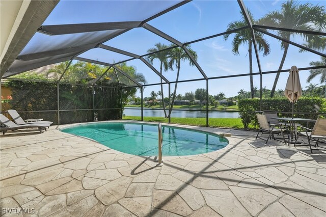 902 Marble Dr, Naples, FL 34104 - swimming pool featuring a patio area, a water view, and a lanai