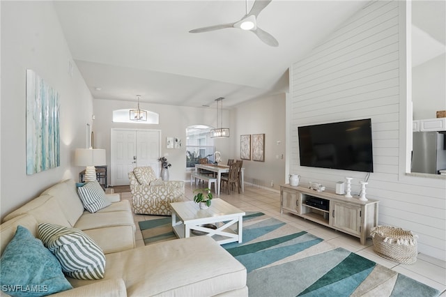 902 Marble Dr, Naples, FL 34104 - living room featuring light tile patterned floors, a ceiling fan, and vaulted ceiling