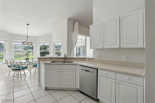 902 Marble Dr, Naples, FL 34104 - kitchen with stainless steel dishwasher, a chandelier, and white cabinets