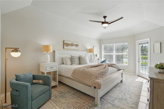 902 Marble Dr, Naples, FL 34104 - bedroom featuring access to exterior, light tile patterned floors, a raised ceiling, and ceiling fan