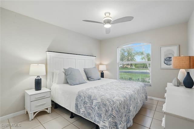 902 Marble Dr, Naples, FL 34104 - bedroom featuring light tile patterned floors and ceiling fan
