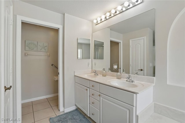 902 Marble Dr, Naples, FL 34104 - bathroom with double vanity and tile patterned flooring