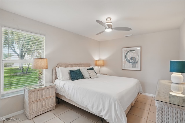 902 Marble Dr, Naples, FL 34104 - bedroom with light tile patterned flooring and a ceiling fan