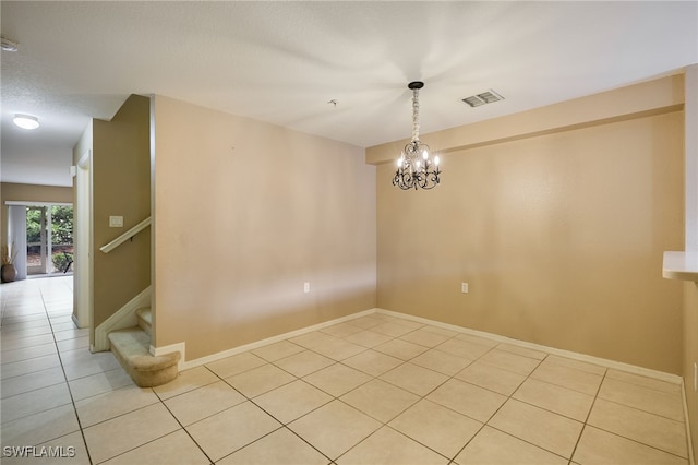 12021 Rock Brook Run Unit 2106, Fort Myers, FL 33913 - unfurnished room with light tile patterned floors, stairway, and a chandelier