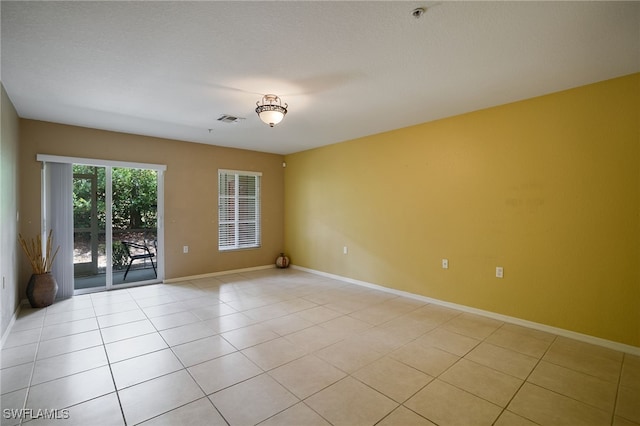 12021 Rock Brook Run Unit 2106, Fort Myers, FL 33913 - empty room featuring light tile patterned flooring and a pendent fire sprinkler