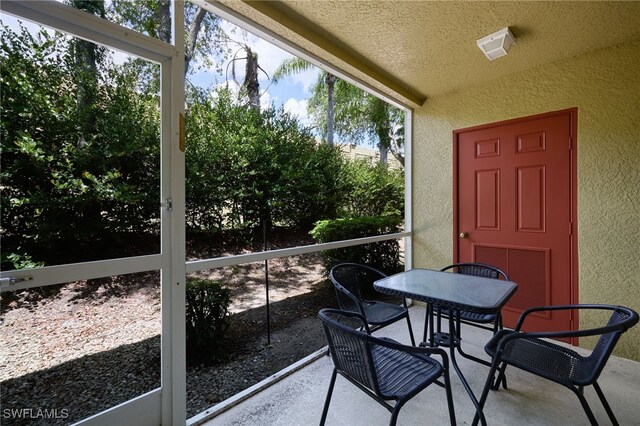 12021 Rock Brook Run Unit 2106, Fort Myers, FL 33913 - sunroom with outdoor dining area