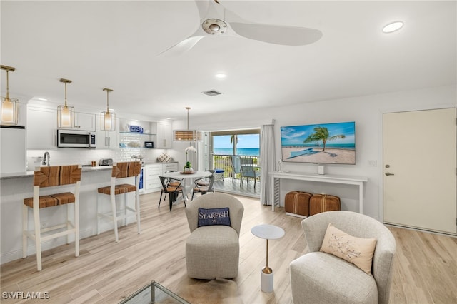 827 E Gulf Dr Unit C6, Sanibel, FL 33957 - living room with light wood-type flooring, recessed lighting, and ceiling fan