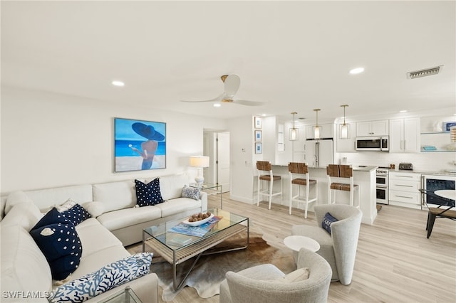 827 E Gulf Dr Unit C6, Sanibel, FL 33957 - living area featuring recessed lighting, light wood-style flooring, and a ceiling fan