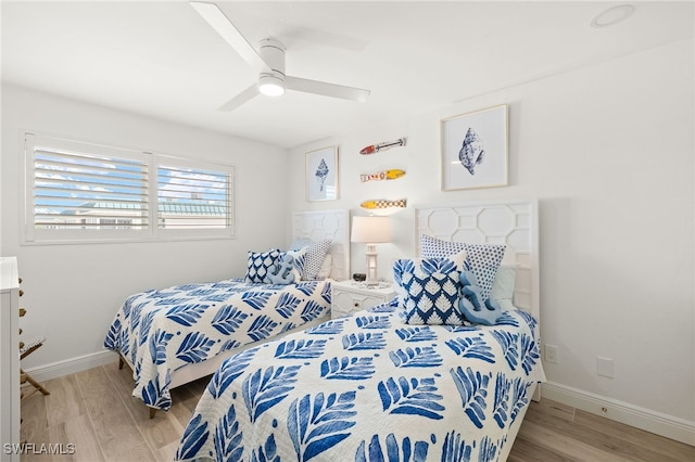 827 E Gulf Dr Unit C6, Sanibel, FL 33957 - bedroom with wood finished floors and ceiling fan