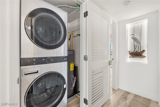 827 E Gulf Dr Unit C6, Sanibel, FL 33957 - laundry area featuring estacked washer and dryer, wood finished floors, and water heater