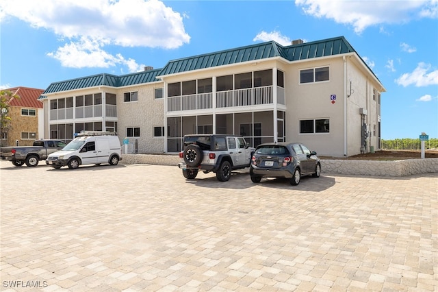 827 E Gulf Dr Unit C6, Sanibel, FL 33957 - view of property with uncovered parking