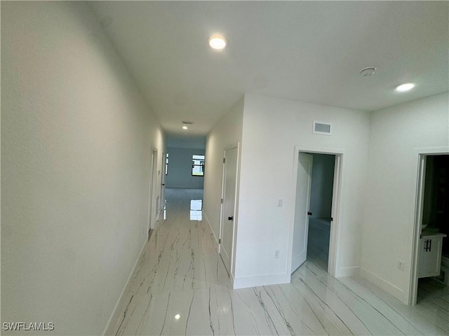 6010 Acorn Cir, Labelle, FL 33935 - corridor featuring light marble finish floors, baseboards, and recessed lighting