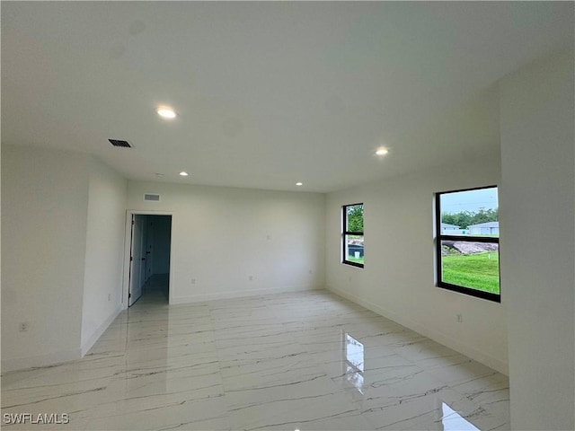 6010 Acorn Cir, Labelle, FL 33935 - unfurnished room with recessed lighting, light marble finish floors, and baseboards