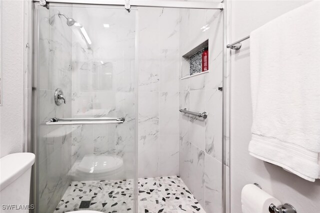 3742 Treasure Cove Cir, Naples, FL 34114 - full bathroom featuring toilet and a marble finish shower