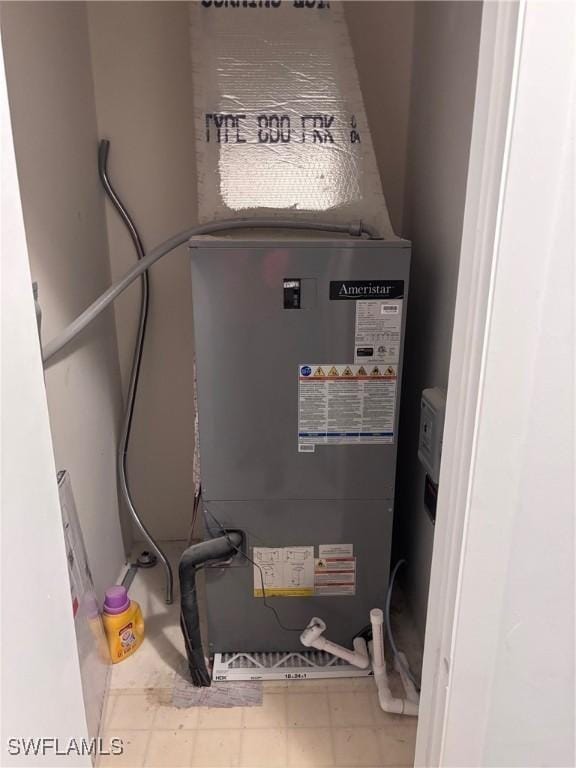 339 Joel Blvd Unit 221, Lehigh Acres, FL 33936 - utility room featuring heating unit