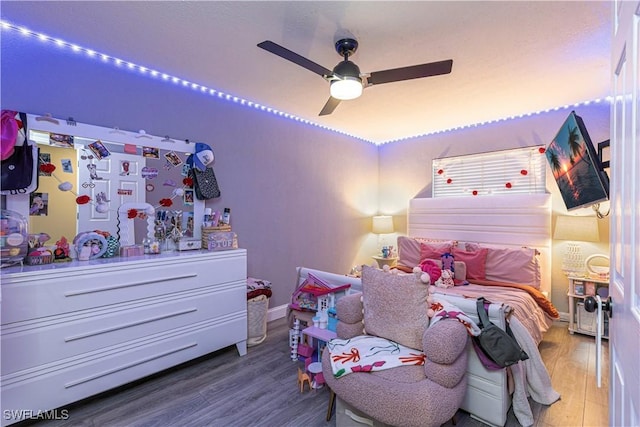 758 105th Ave N, Naples, FL 34108 - bedroom with wood finished floors and a ceiling fan