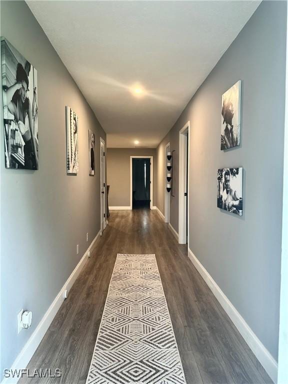 758 105th Ave N, Naples, FL 34108 - hallway featuring dark wood-style floors and baseboards