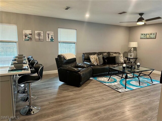 758 105th Ave N, Naples, FL 34108 - living area with baseboards, wood finished floors, and ceiling fan