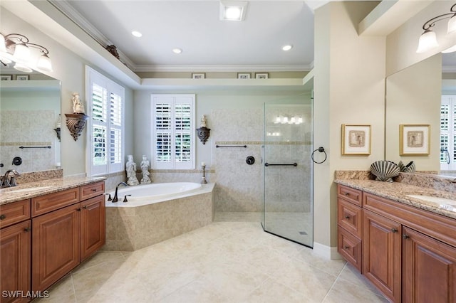 10026 Lions Bay Ct, Naples, FL 34120 - full bathroom featuring ornamental molding, a bath, two vanities, a walk in shower, and tile patterned floors