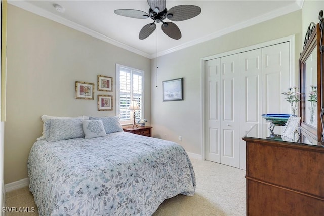 10026 Lions Bay Ct, Naples, FL 34120 - bedroom featuring light colored carpet, ornamental molding, a closet, and a ceiling fan