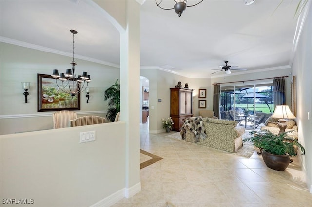 10026 Lions Bay Ct, Naples, FL 34120 - living area with arched walkways, a chandelier, light tile patterned flooring, a ceiling fan, and crown molding
