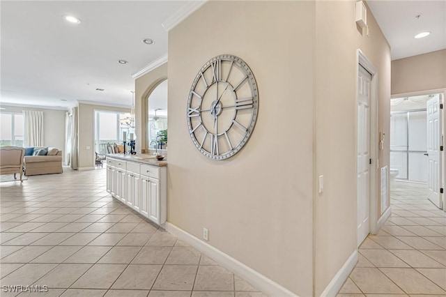9121 Southmont Cv Unit 204, Fort Myers, FL 33908 - corridor featuring light tile patterned floors, ornamental molding, baseboards, and recessed lighting