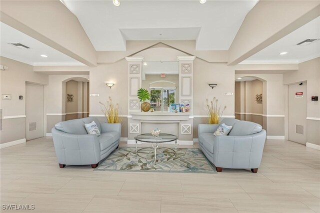9121 Southmont Cv Unit 204, Fort Myers, FL 33908 - living area featuring arched walkways, recessed lighting, baseboards, and crown molding