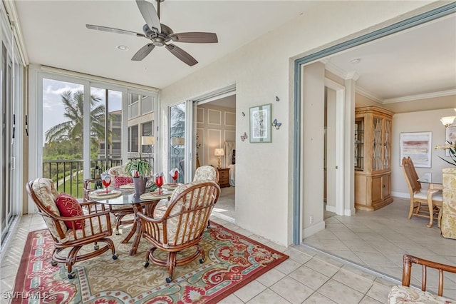9121 Southmont Cv Unit 204, Fort Myers, FL 33908 - sunroom with tile patterned floors, a chandelier, baseboards, and crown molding