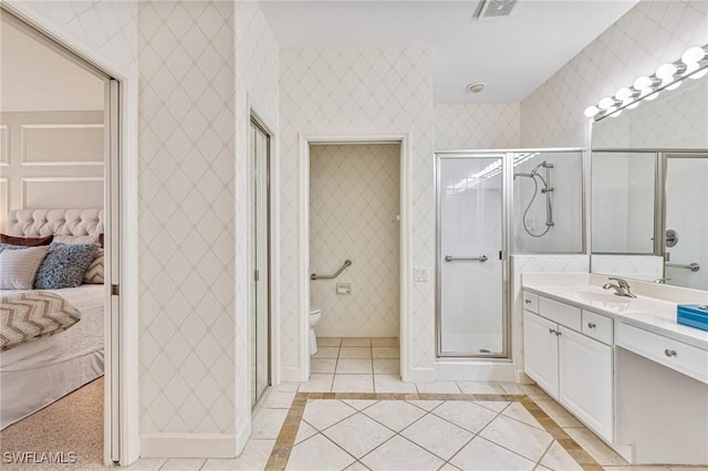 9121 Southmont Cv Unit 204, Fort Myers, FL 33908 - ensuite bathroom featuring vanity, toilet, a shower stall, baseboards, and tile patterned floors