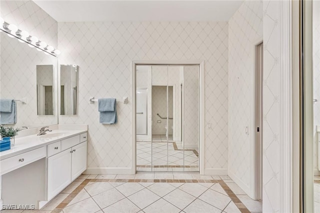 9121 Southmont Cv Unit 204, Fort Myers, FL 33908 - full bath featuring vanity, tile patterned floors, inlaid floor details, and baseboards